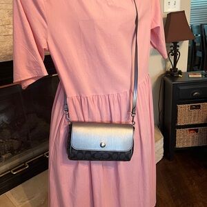 Coach black and silver reversible clutch crossbody